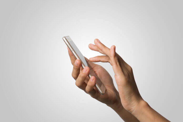 woman hand holding smartphone on a blank screen